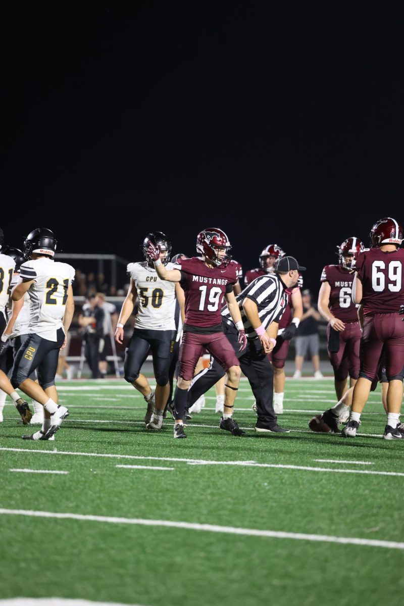Holden Hlavacek (19) celebrates a first down during his game on Friday, Oct. 3.