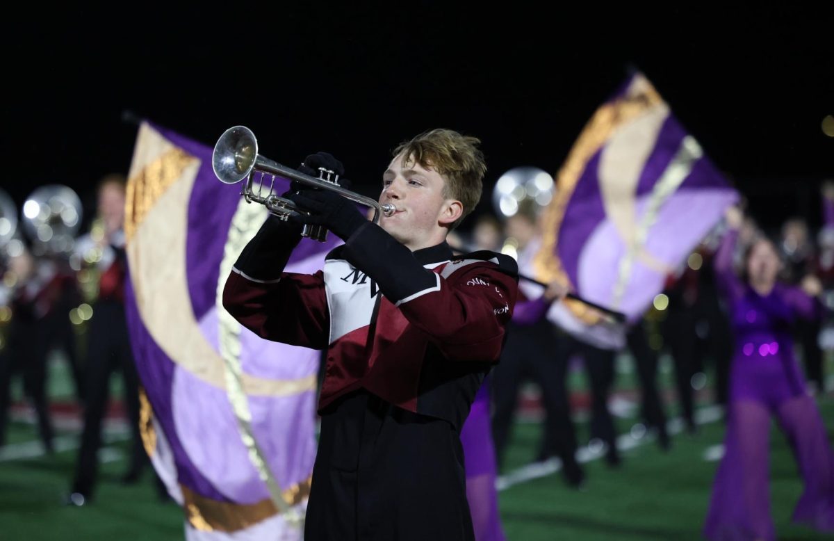 Junior Nathaniel Lewis plays with the band during their final 2025 performance.