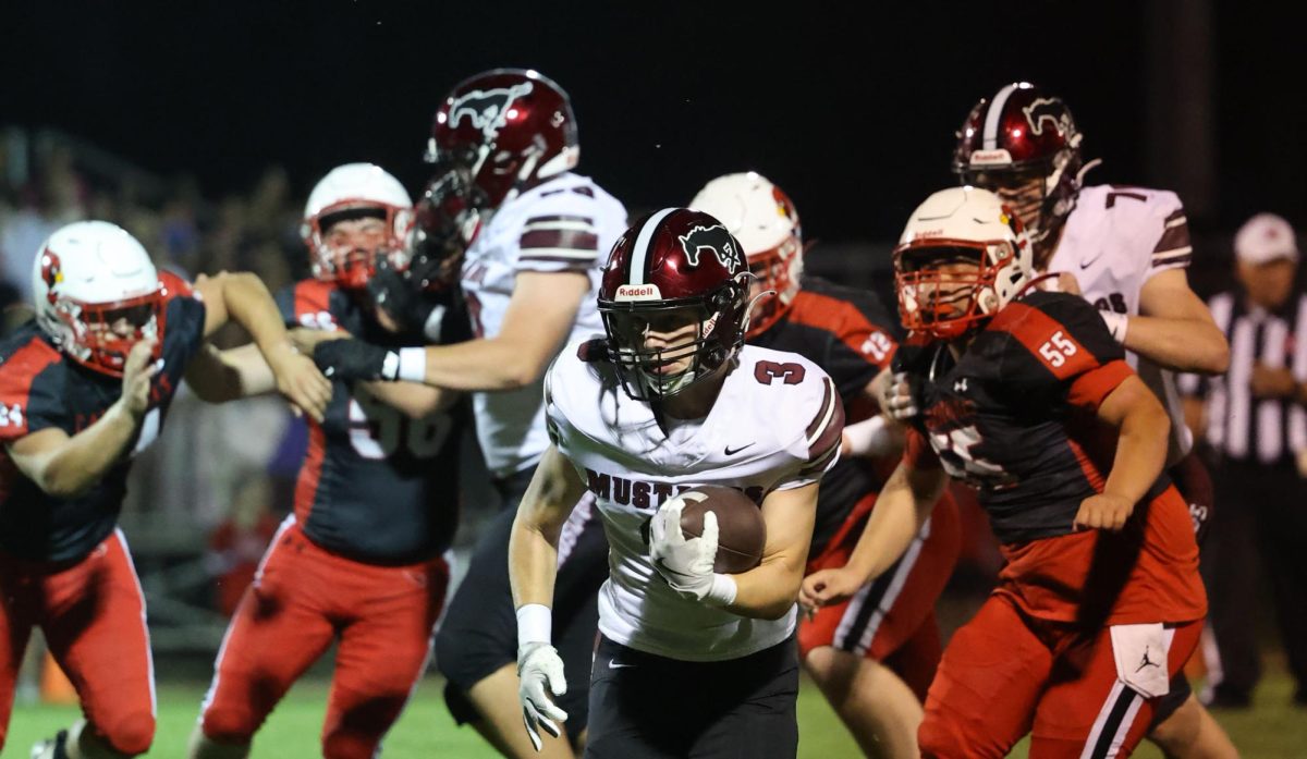 MIkey Ryan runs the ball against Monticello Sept. 26. The Mustangs won 50-0.