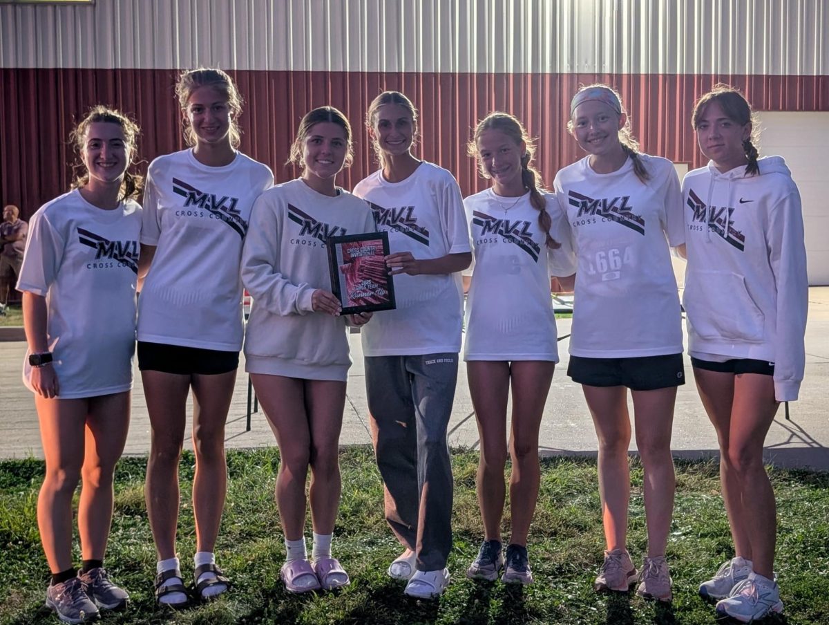 The top seven varsity runners pose at Williamsburg after placing 2nd. 