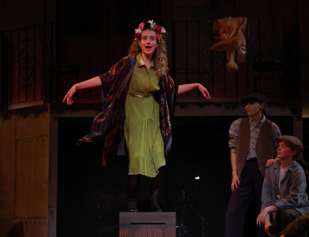 Senior Claire Jensen (Persephone) laments about her return to Hadestown during the song "Way Down Hadestown".