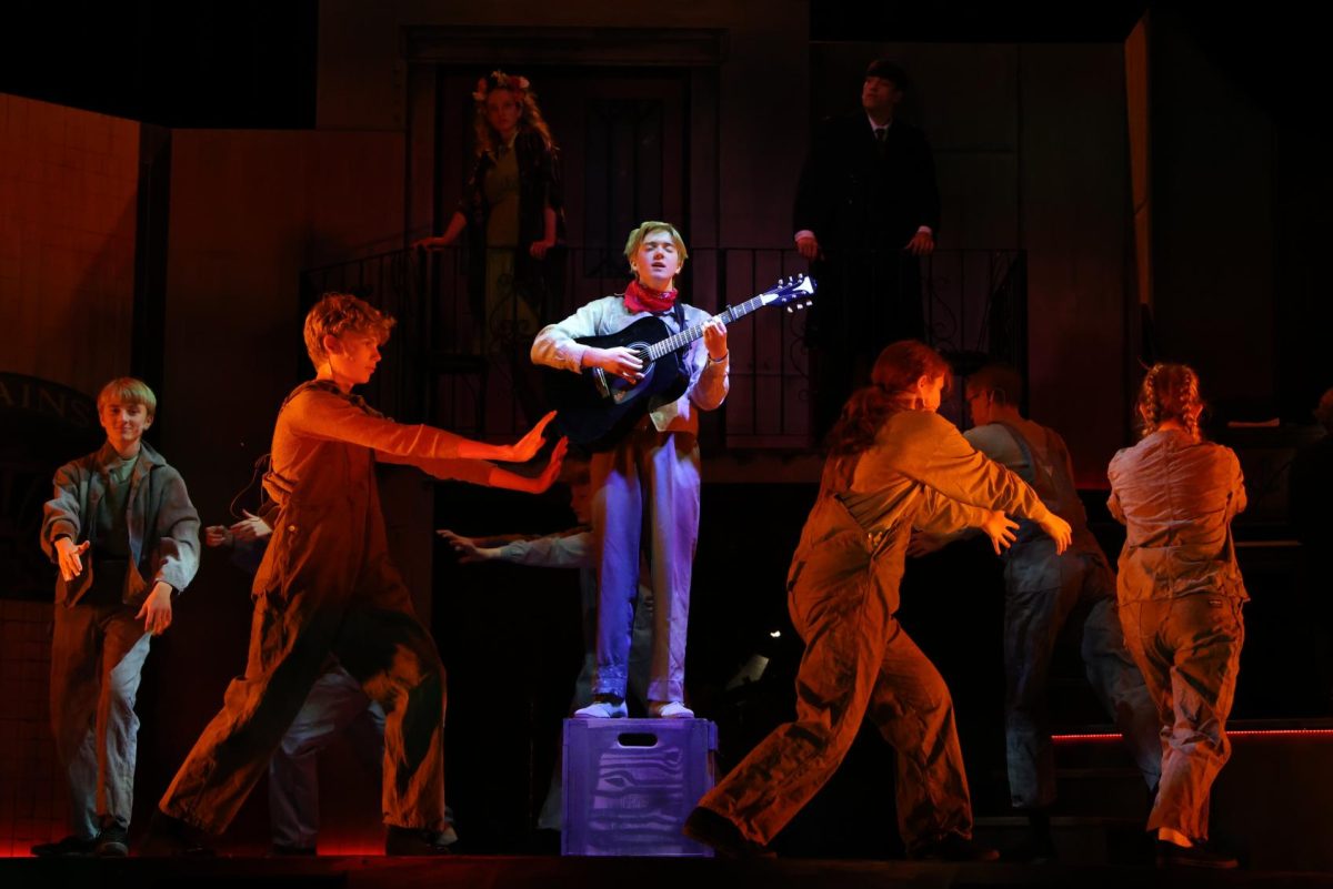 Junior Chester Rood (Orpheus) tries to finish his song as a storm comes in during "Chant". 