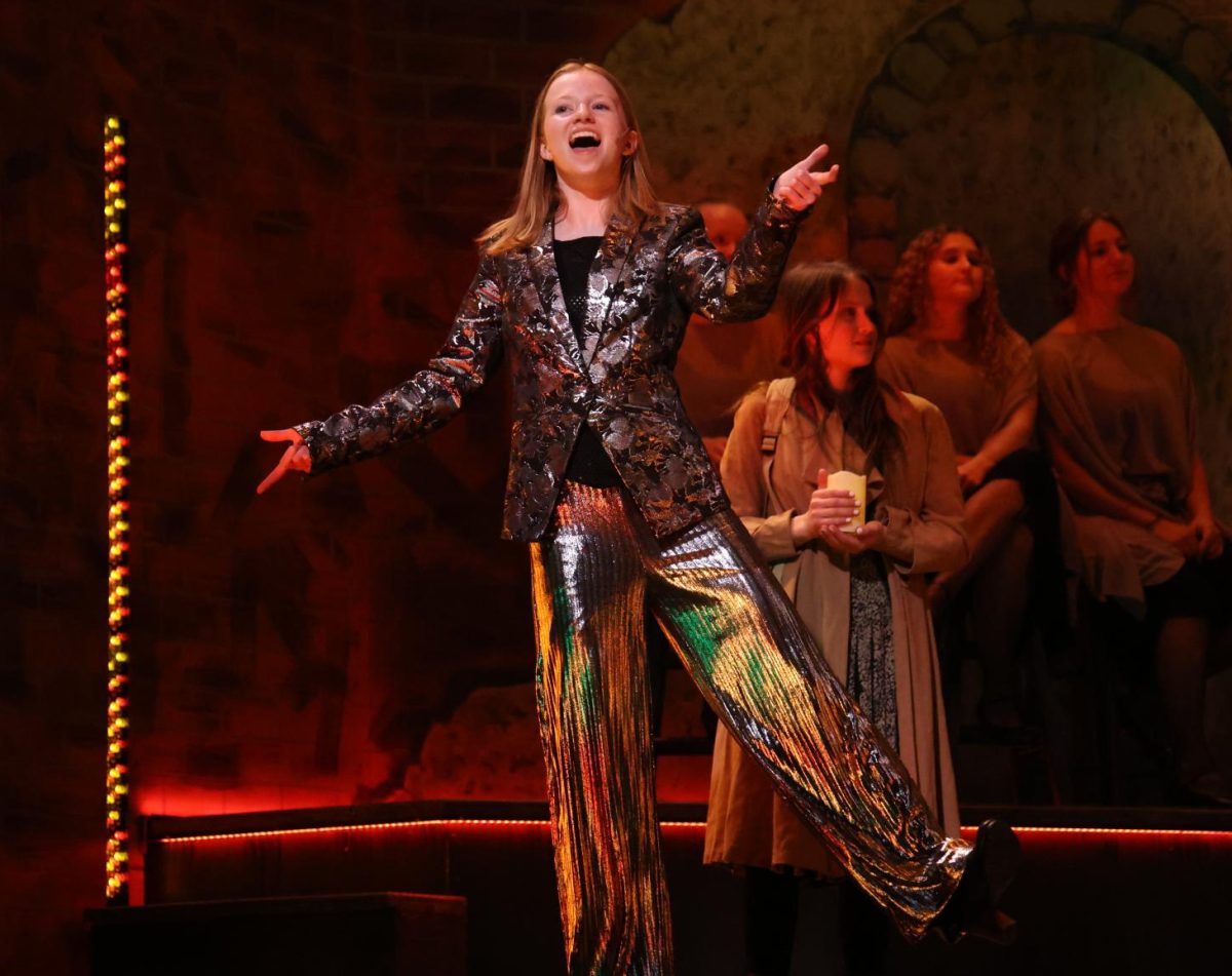 Senior Ingrid Morf, as Hermes, concludes the story as she performs "Road to Hell (Reprise)". 