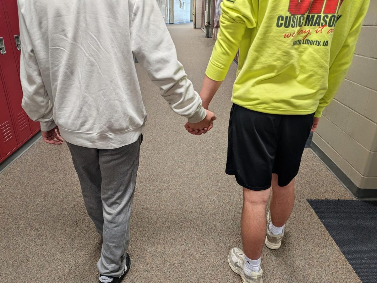 Anonymous students holding hands