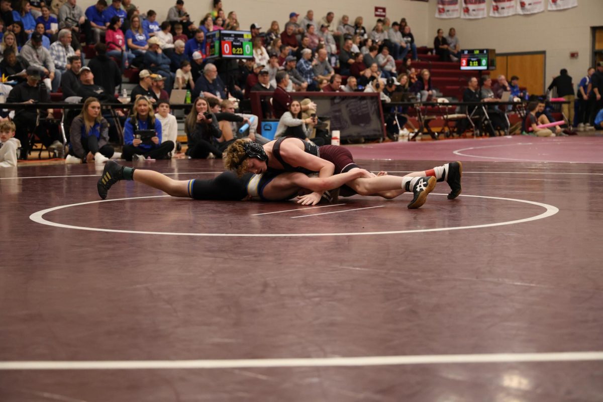 Sophomore Matthew Goodlove wrestles a student from Benton during the Jan. 8 Wrestling Triangular.