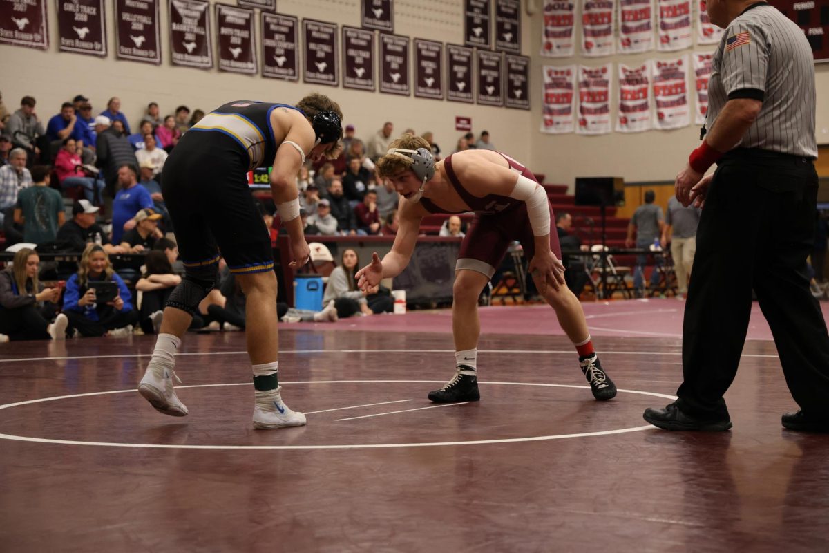 Senior Michael Ryan shakes the hand of his Benton opponent before their match begins.