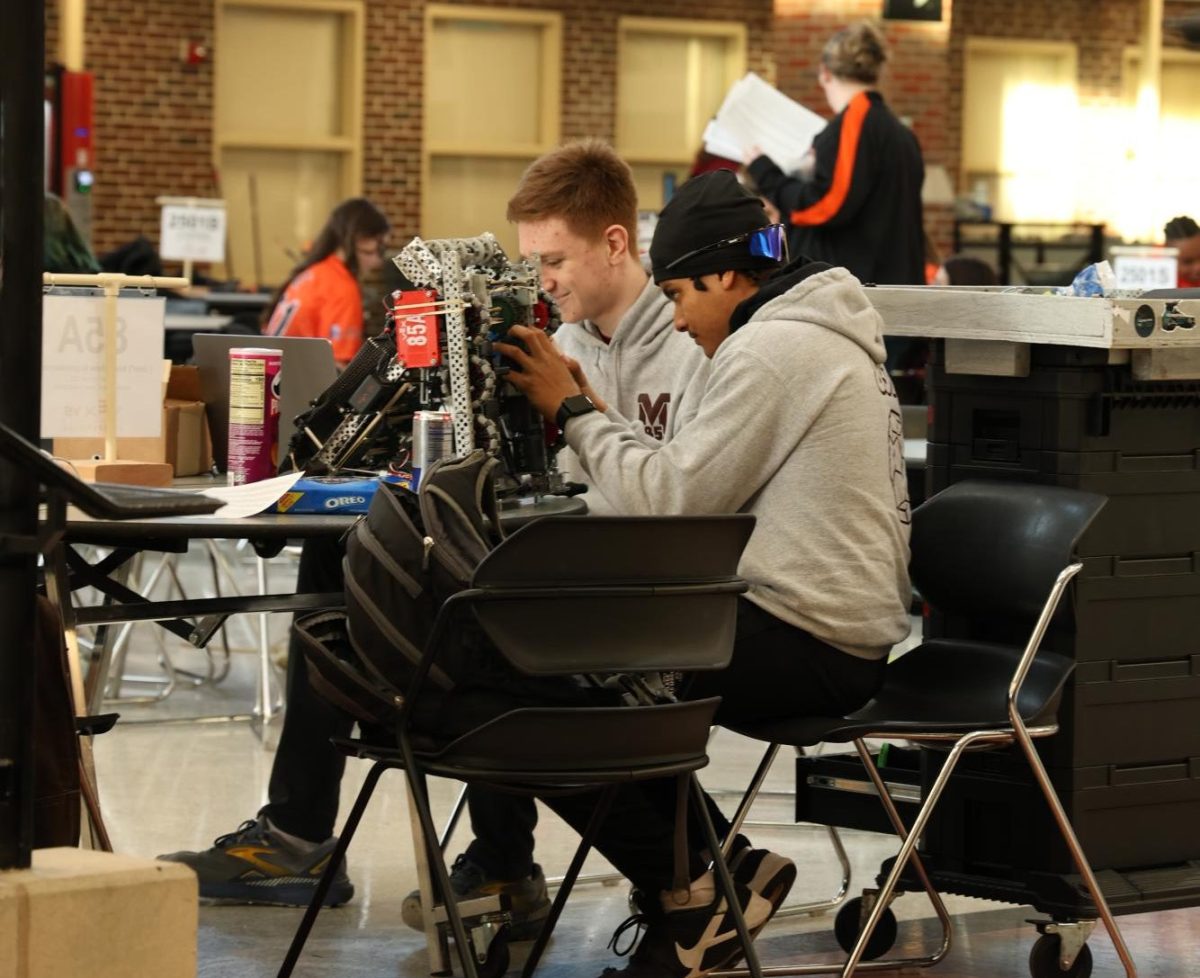 Juniors Matthew Bradbury and Porter Chatman make final adjustments to their robot.