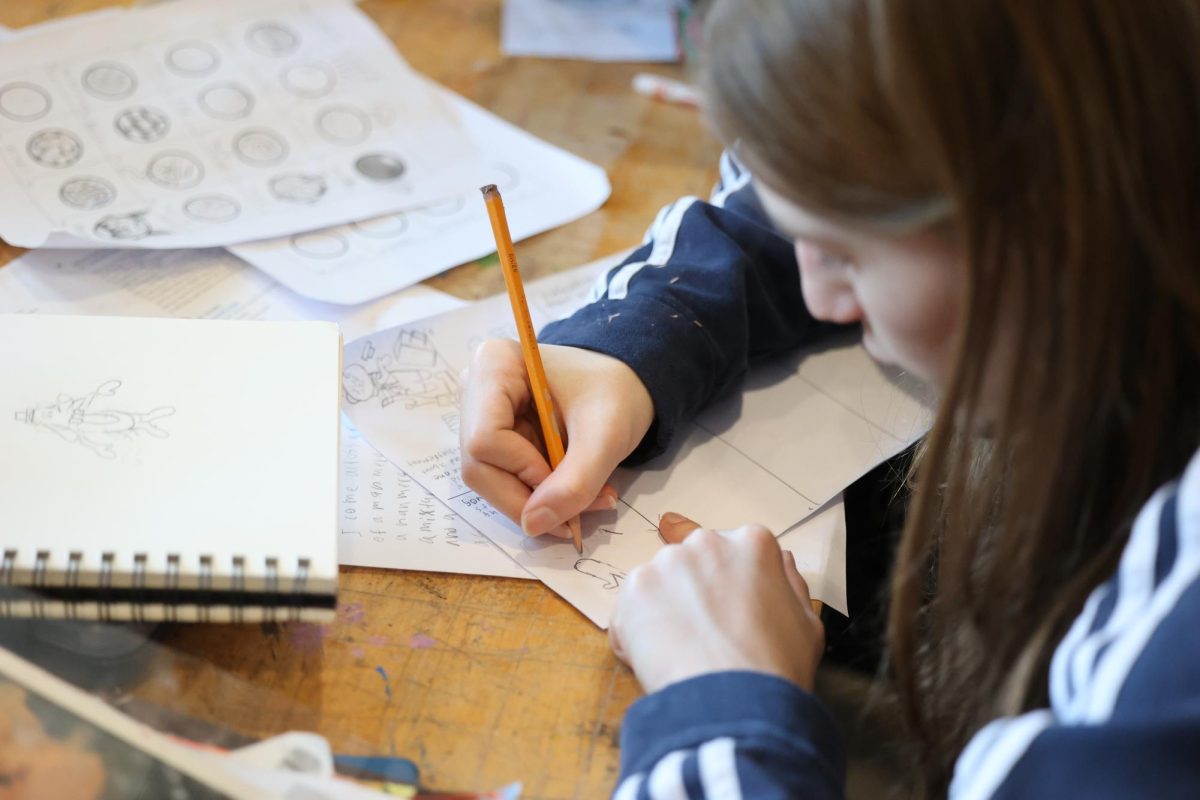 Junior Collin Clark is a woking really hard on his sketching during class on Jan. 8. After that instead of taking a break right away he continued to work instead. 