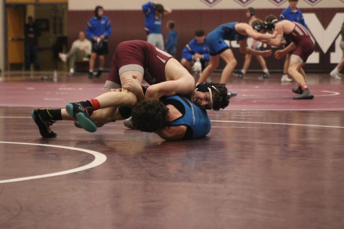 Junior Cooper Krob (120) wrestles Clear Creek's Tytus Steapp at the Mount Vernon triangular.