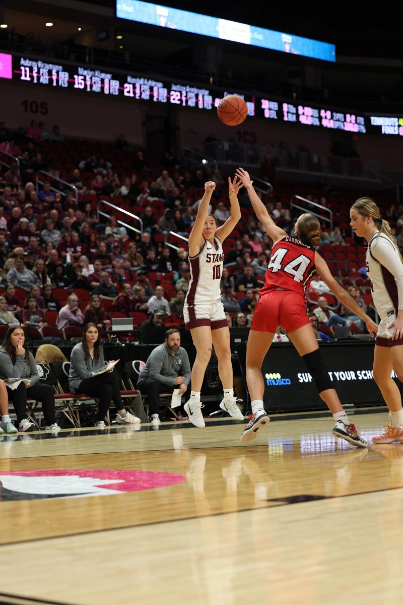 Savanna Wright shoots a 3-pointer. She scored 19 points in the game.