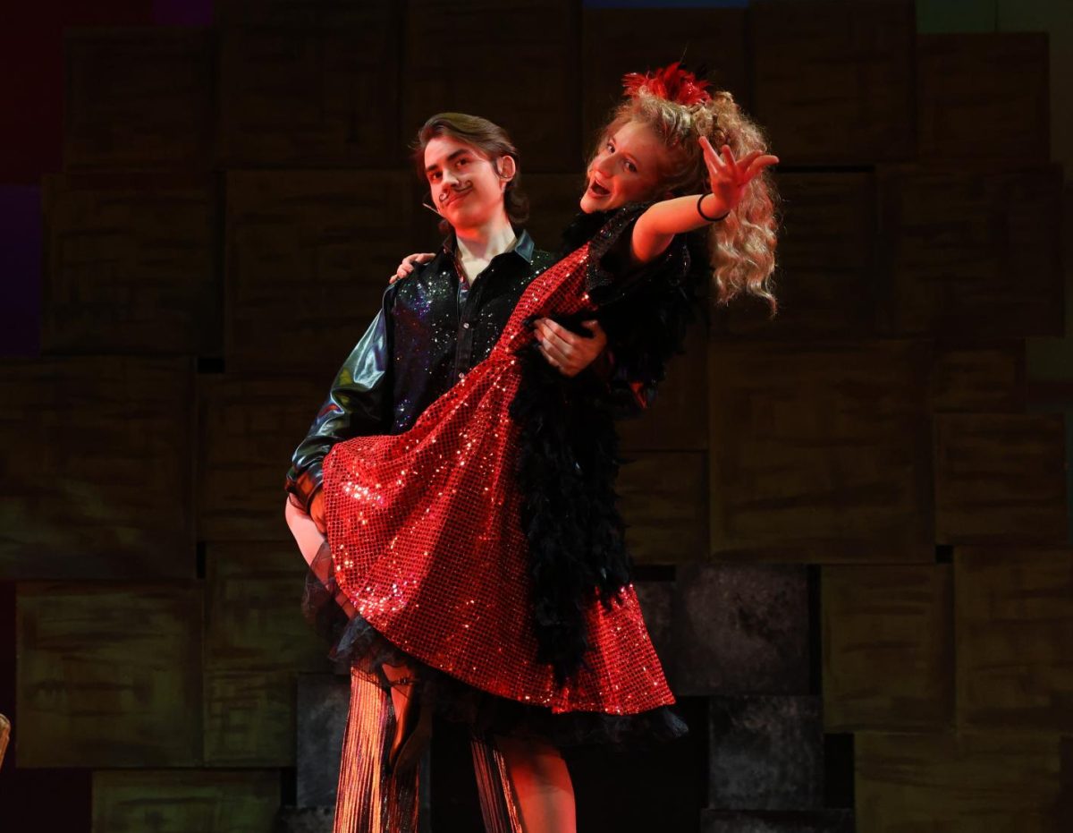 Sophomore Elliott McNulty (Rudolpho) and senior Claire Jensen (Mrs. Wormwood) finish out their performance of "Loud".