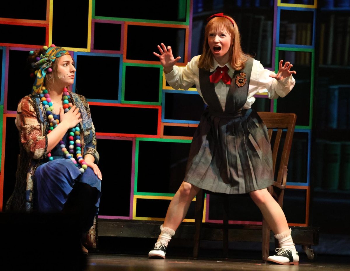Senior Ingrid Morf, as Matilda, tells the story of the Escapologist and Acrobat to senior Addi Whisner (Mrs. Phelps).