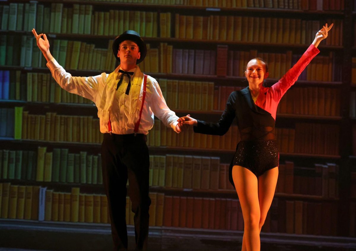 Sophomore Beck Oesterle and senior Claire Thuerauf get ready to perform their trick as the Escapologist and Acrobat.
