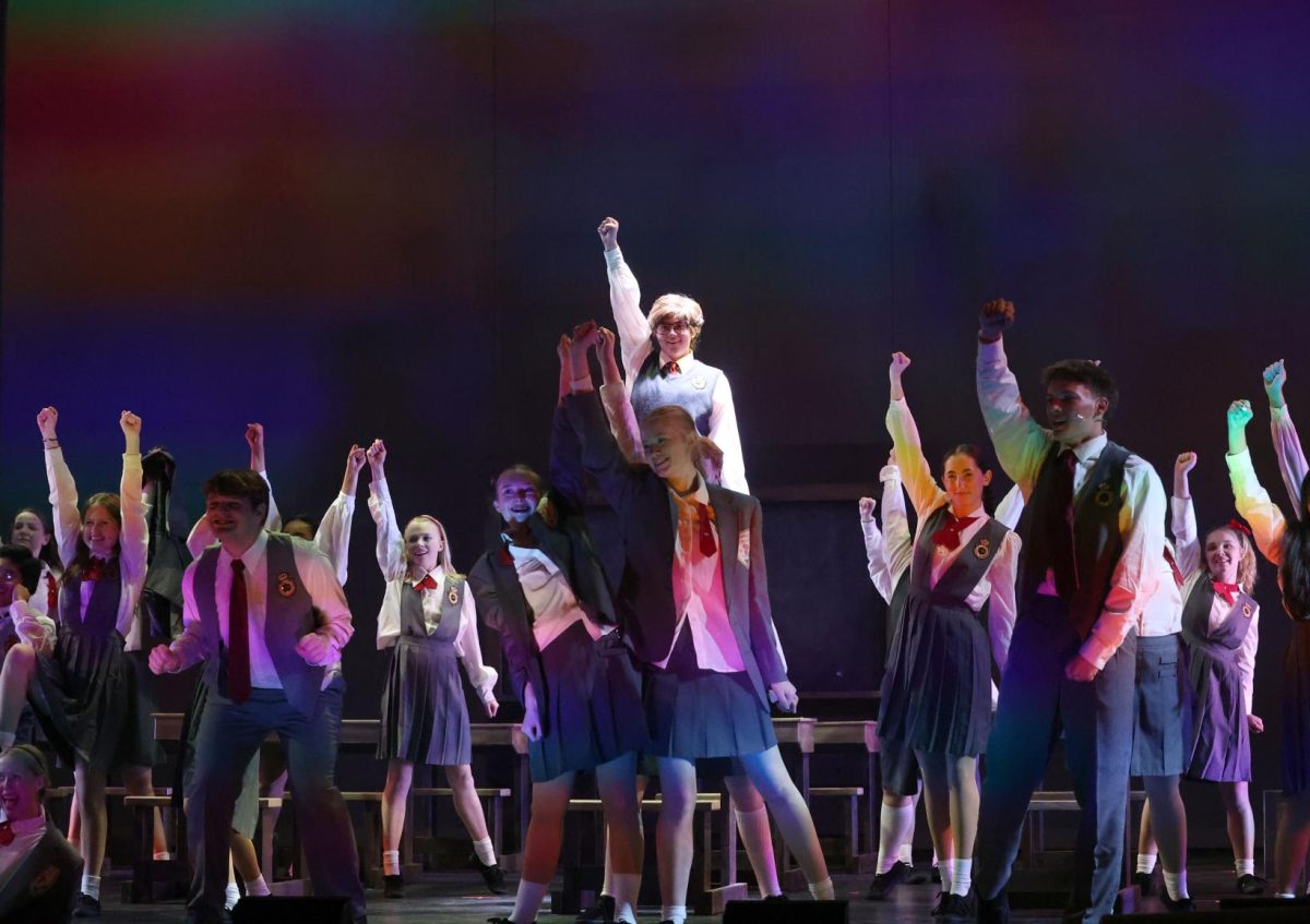 The cast of Matilda hits their final pose at the end of "Revolting Children". 