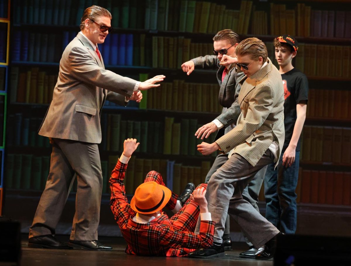 Senior Owen Francois (Sergei) stops  Mr. Wormwood from being beat up. 