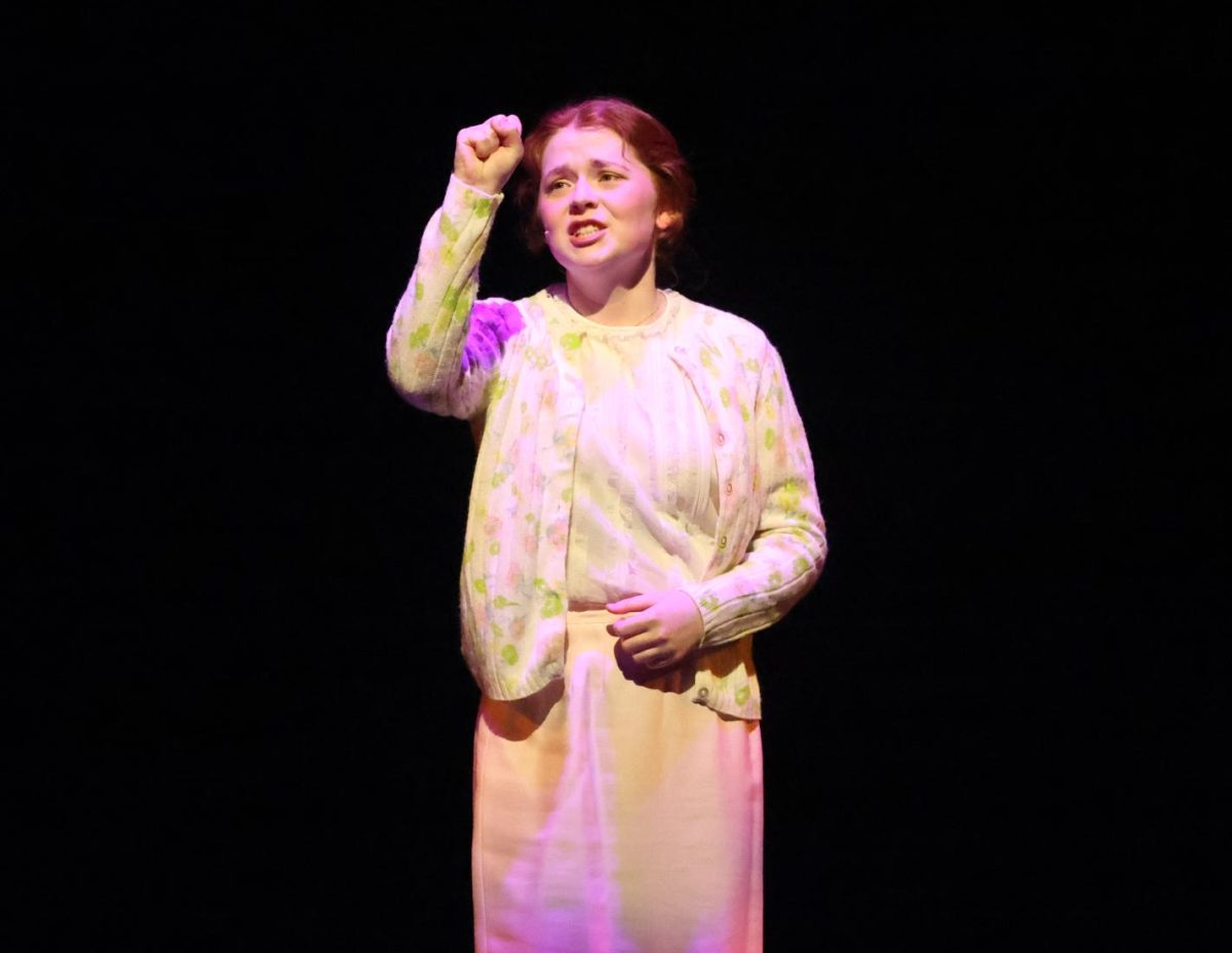 Junior Reagan Slaymaker, as Miss Honey, wills herself to knock on the door during "Pathetic".